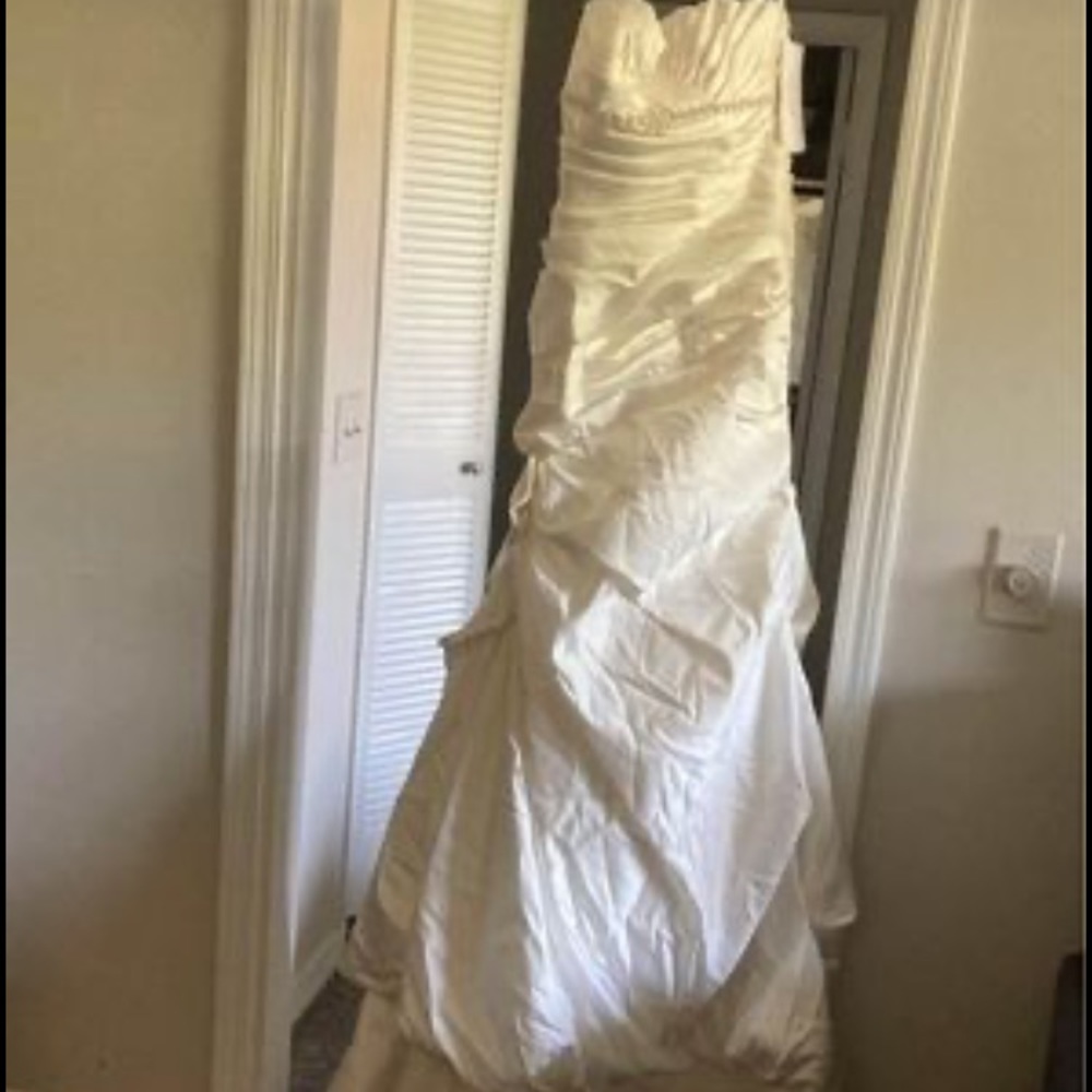 Wedding dress never used from David bridal